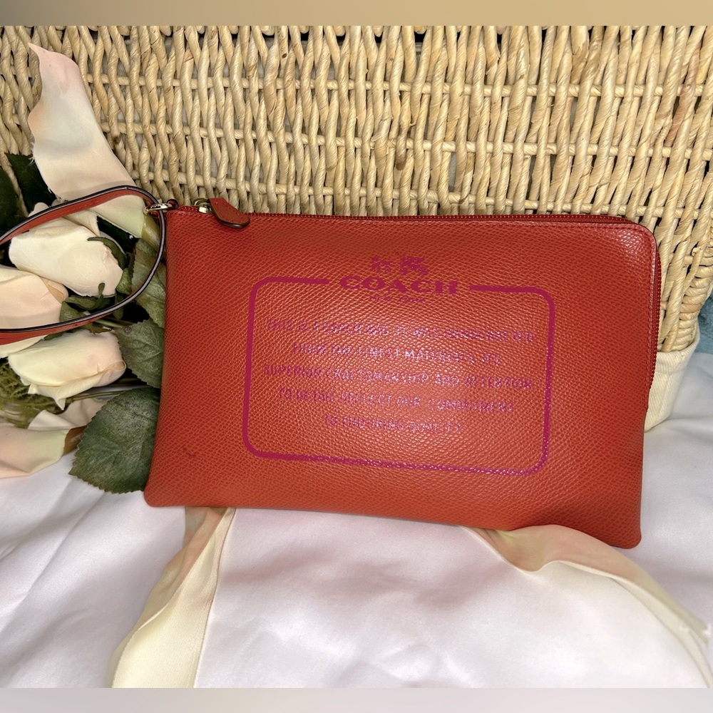 EUC COACH STORYPATCH WRISTLET- ORANGE/FUSCIA